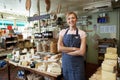 Owner Of Delicatessen Standing In Shop Royalty Free Stock Photo