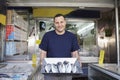 Owner Displaying Fresh Fish In Store