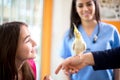 Owner with her pet in vet ambulant