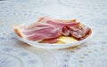 The owner of the house in the village offered tourists to taste the prosciutto. Royalty Free Stock Photo