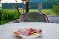 The owner of the house in the village offered tourists to taste the prosciutto. Royalty Free Stock Photo