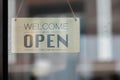 Welcome open shop barista waitress open sign on glass door modern coffee shop ready to serve cafe restaurant retail store small bu Royalty Free Stock Photo