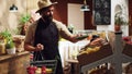 Owner restocking his local grocery shop