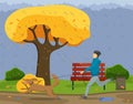 The owner runs with dog in autumn rainy park. Yellow foliage, puddles, rain, gray heavy sky