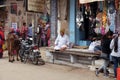 The owner sits in front of his grocery store in Pushkar, India Royalty Free Stock Photo