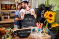 Owner in their cafe store showing open sign Royalty Free Stock Photo