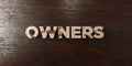 Owners - grungy wooden headline on Maple - 3D rendered royalty free stock image