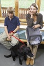 Owners Sitting In Vets Reception Area Royalty Free Stock Photo