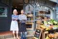 Owners Standing Next To Produce Display At Deli Royalty Free Stock Photo