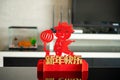 Ox mascot with lantern in room as symbol of Chinese New Year of the Ox 2021