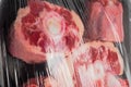 Ox tail on black plastic trey wrapped in plastic. Royalty Free Stock Photo