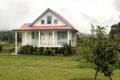 Wooden house in pastel colours in Oxapampa city