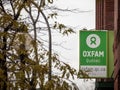 Oxfam logo in front of their local charity shop in Montreal, Quebec. Oxfam is an NGO specialized in fighting poverty Royalty Free Stock Photo