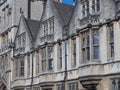 Bay windows look out onto the street from one of the ancient Oxford colleges