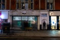 OXFORD STREET, LONDON, ENGLAND- 14 November 2021: Closed shop on Oxford Street at night