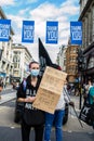 OXFORD STREET, LONDON/ENGLAND- 6 September 2020: Female protester with a sign as part of an All Black Lives UK protest