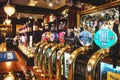 Oxford, UK - 02 March 2020: Rows of draught beer in a typical British pub