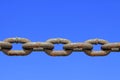 oxidation rusty chains under the blue sky Royalty Free Stock Photo