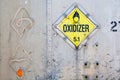 Oxidizer placard on decayed metal container Royalty Free Stock Photo