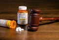 Oxycodone opioid tablets with judge gavel for court decision about liability Royalty Free Stock Photo