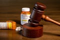 Oxycodone opioid tablets with judge gavel for court decision about liability