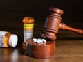 Oxycodone opioid tablets with judge gavel for court decision about liability Royalty Free Stock Photo