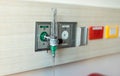 Oxygen flow meter plugged in the green outlet on hospital wall, Medical equipment. Oxygen for patients in the wall. Royalty Free Stock Photo