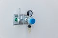 Oxygen flow meter plugged in the green outlet on hospital wall, Medical equipment. Oxygen for patients in the wall. Oxygen Gas Pip Royalty Free Stock Photo