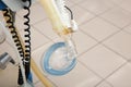 Oxygen mask as part of artificial lungs ventilation machine in surgery room, closeup Royalty Free Stock Photo