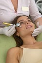 Oxygen mesotherapy. Cosmetic peeling procedure. Non-injection mesotherapy for a young girl in a beauty salon.