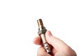 Oxygen sensor for gasoline and diesel engines in the hand isolated on white. lambda probe is reliable component to