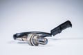 The oxygen sensor is a new lambda sensor. Spare parts on the car on a gray gradient background