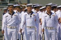 Oyal Thai Navy petty officers in summer white uniform hold M16 rifles with bayonets on board ship