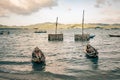 Oyster cages await fisherman to deploy them on a lake in vietnam