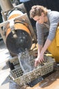 Oyster farmer cleans produce near famous bassin darcachon Royalty Free Stock Photo