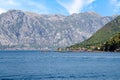 Oyster farms in Bay of Kotor against mountains and small town Perast, Montenegro Royalty Free Stock Photo