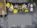 Oyster on ice, lemon slices, wine bottle and glass. Delicatessen and gourment food, rich in iodine, antioxidants, zinc