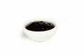 Oyster sauce in a bowl on a white plate. For the restaurant menu. Traditional Japanese sushi seasoning. Healthy eating