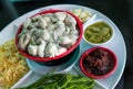 Oysters food and chili sauce,Thai food is Oysters with Herbs or Oyster Spicy Salad. Oysters with chili paste, fried onions,red oni Royalty Free Stock Photo