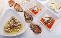 Oysters and sardine fillets with olives