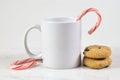 11 oz. Christmas Coffee Mug Mockup with Cookies and Candy Canes Royalty Free Stock Photo