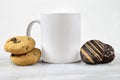 11 oz. White Mug Mockup on Marble Background with Cookies Royalty Free Stock Photo