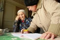 Worker Center of social services for pensioners and the disabled, takes orders from an old lady Royalty Free Stock Photo