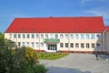 OZERSK, RUSSIA. The building of Ozersk secondary school named after Dmitry Tarasov. Kaliningrad region. Russian text