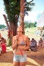 OZORA, HUNGARY - AUGUST 01: Girl blowing bubles on Ozora Festival, one of the greatest psychedelic music gathering in Royalty Free Stock Photo