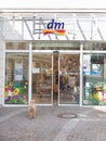 Dm-drogerie markt entrance dog waiting outdoor germany Royalty Free Stock Photo