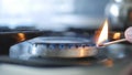 Man In Kitchen Opening Fire with Matches on Gas Cooker Royalty Free Stock Photo