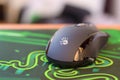P93 Bloody cybersport gaming mouse by A4Tech lies on Razer Goliathus mouse pad. Professional cybersport supply