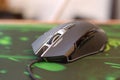P93 Bloody cybersport gaming mouse by A4Tech lies on Razer Goliathus mouse pad. Professional cybersport supply