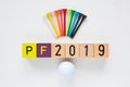 P.F.2019 - an inscription from wooden blocks and golf equipments Royalty Free Stock Photo